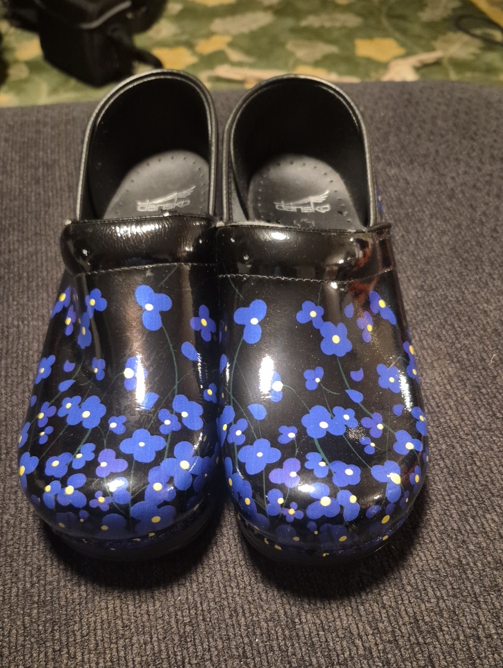 Dansko Kids Black Clogs with Blue Floral Print